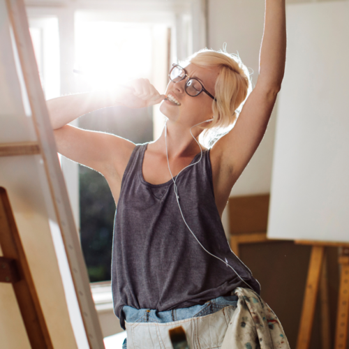 woman painting and enjoying life