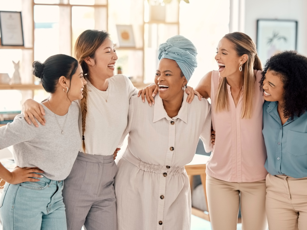 diverse group of women smiling and laughing together