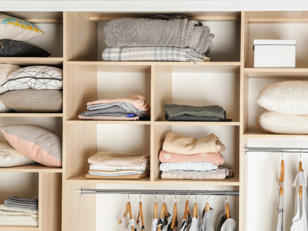 A closet with neatly organized clothes