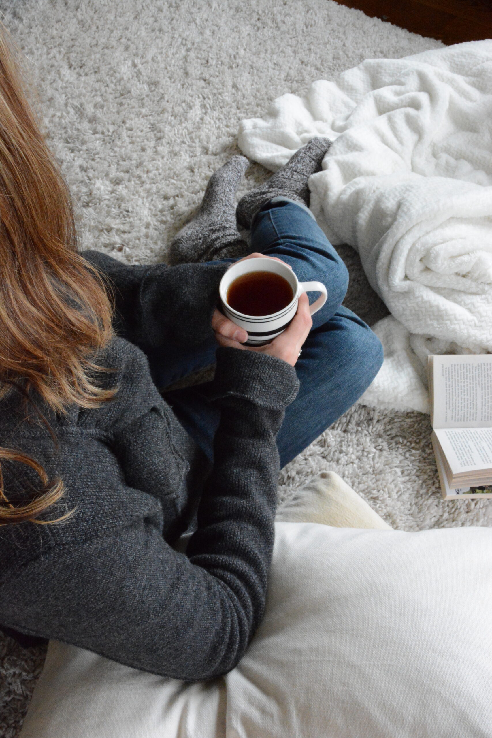 woman sitting with coffee cup in her hand